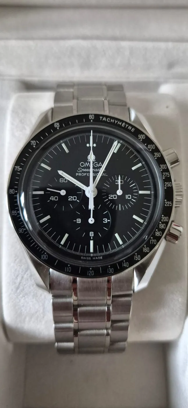 Omega Speedmaster Professional with black dial, tachymeter bezel and steel bracelet, in its box