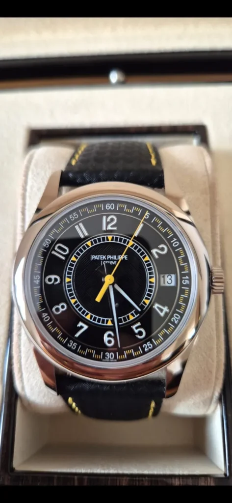 Patek Philippe with black dial and leather strap in its box