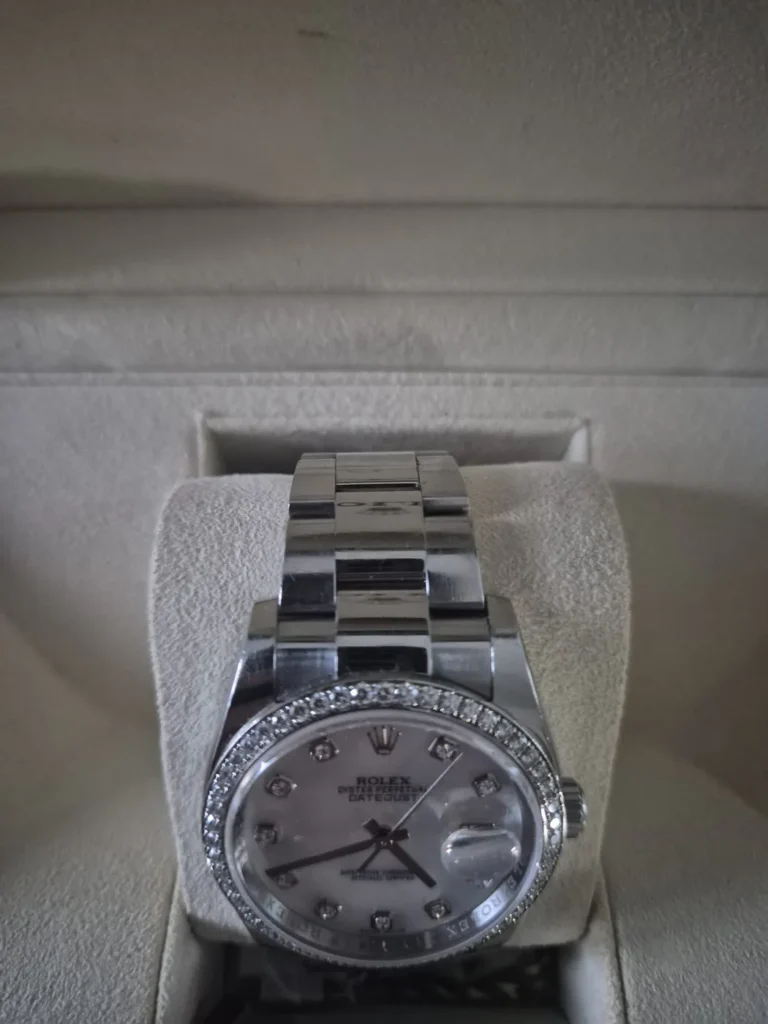 Rolex Datejust with diamond bezel and mother-of-pearl dial in its box
