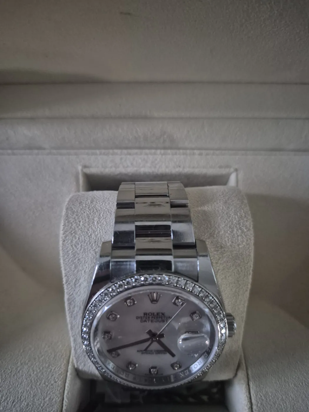 Rolex Datejust with diamond bezel and mother-of-pearl dial in its box