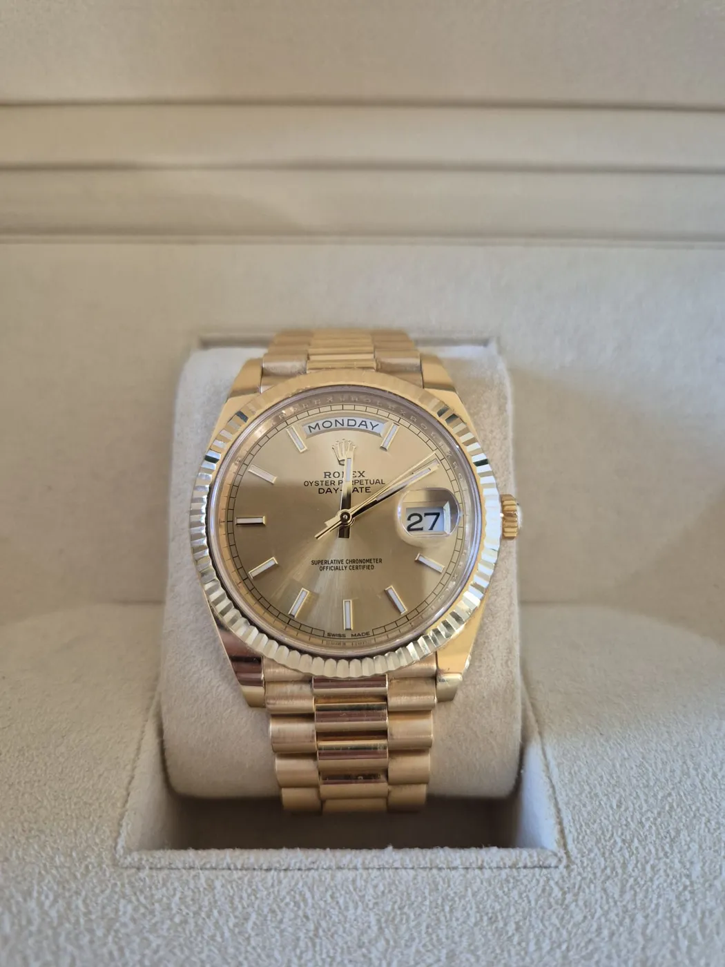 Yellow gold Rolex Day-Date with a fluted bezel in its box