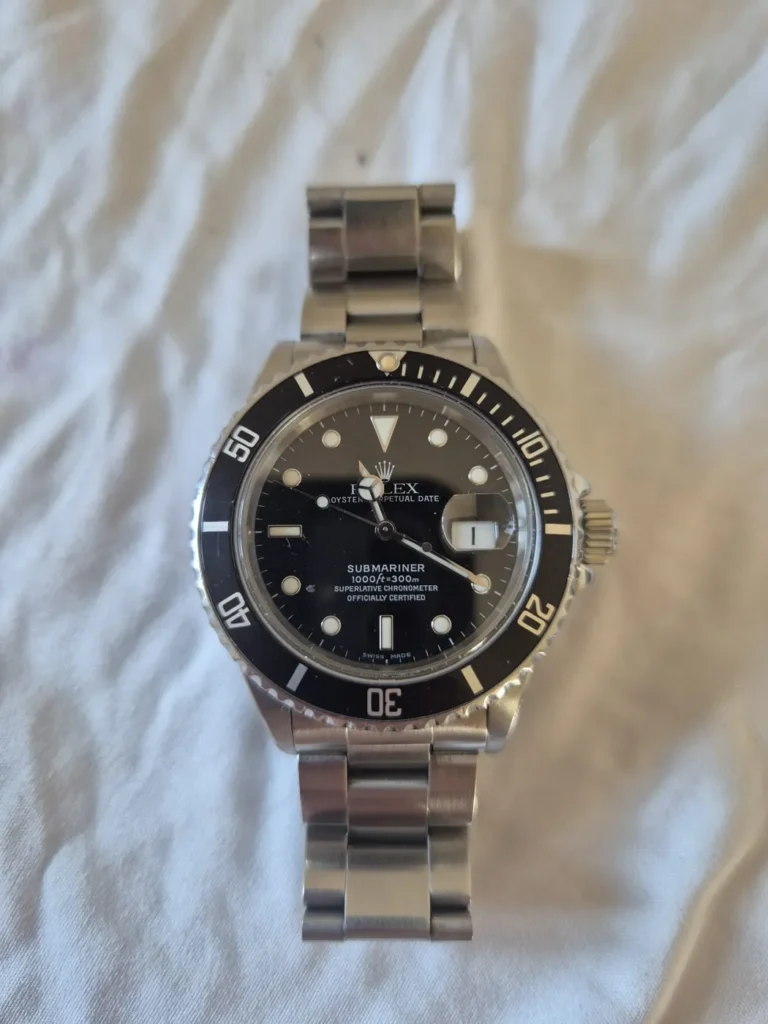 Steel Rolex Submariner Date with black dial and bezel on an Oyster bracelet