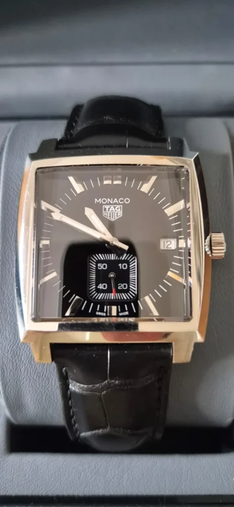TAG Heuer Monaco with square dial and black leather strap in its box